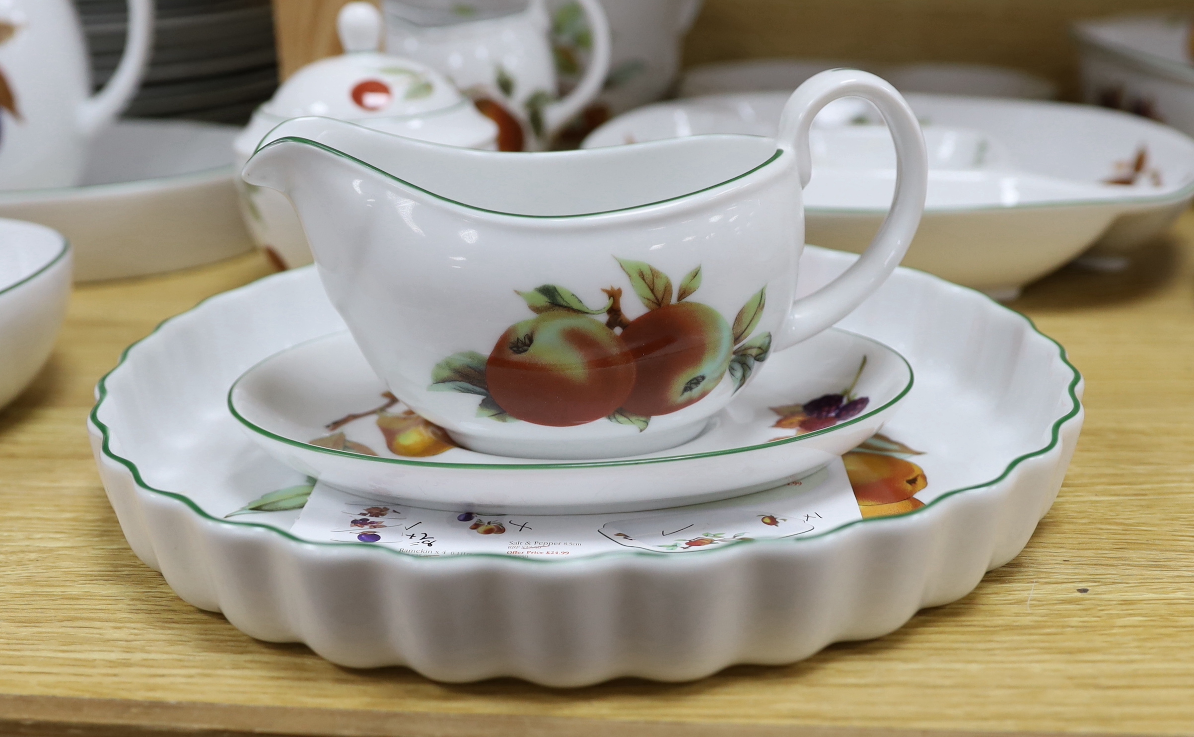 A large quantity of Royal Worcester Evesham Vale serving dishes and dinnerwares